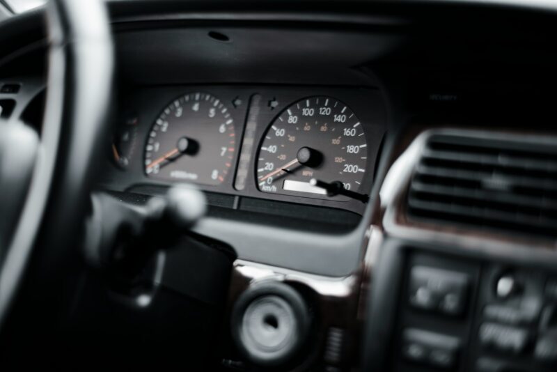 Vehicle Dashboard Focus Car dashboard speedometer blurred through steering wheel.
