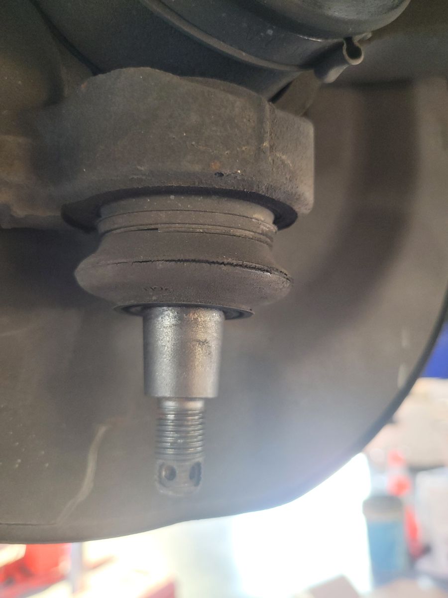 Automotive Suspension Ball Joint Closeup Closeup view of a car suspension ball joint with exposed threads.