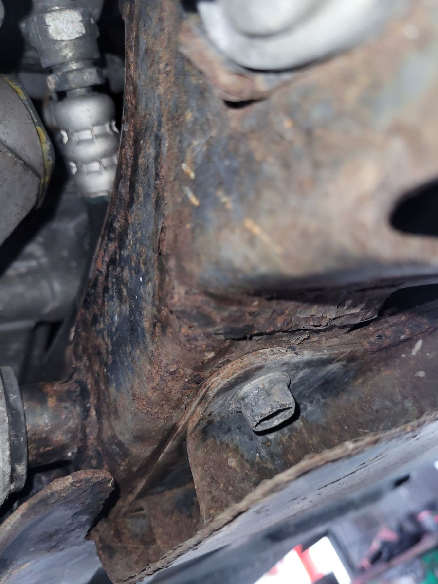 Developing Rust on Vehicle Undercarriage Close-up of rust forming on a car's metal undercarriage