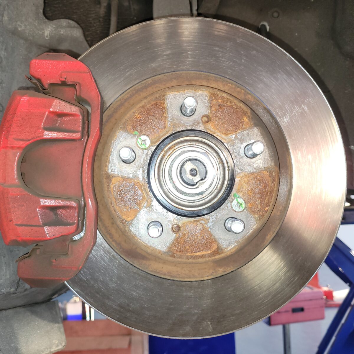 Car brake rotor with red caliper. Car brake rotor with red caliper.
