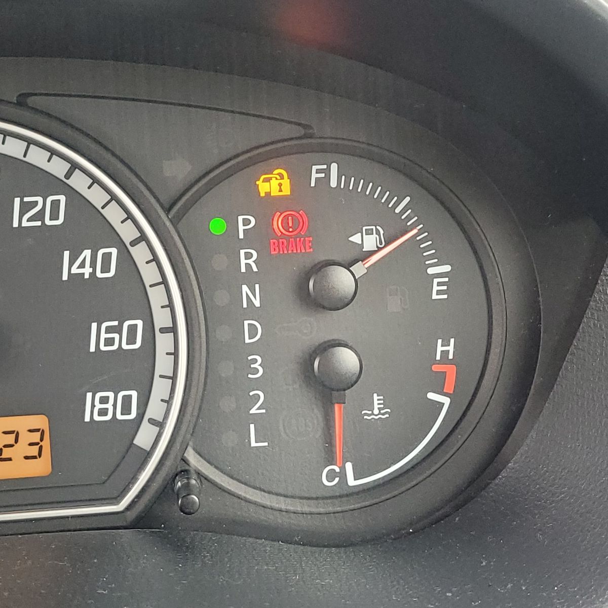 Close-up of car dashboard with fuel gauge on full
