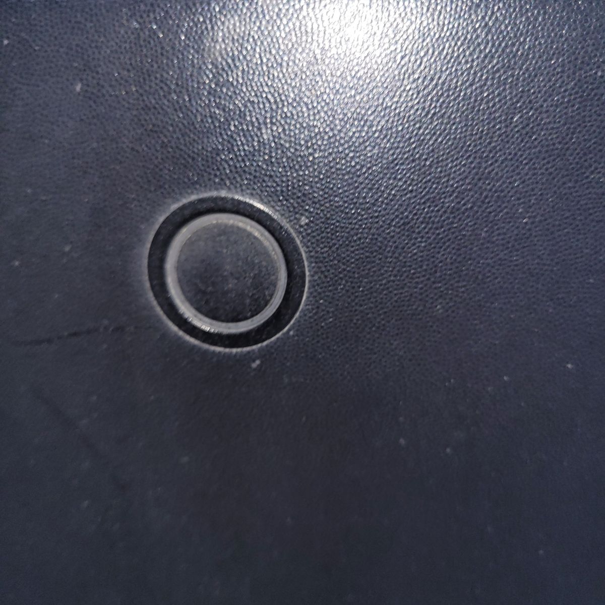 Close-up of Rear Car Parking Sensor Rear parking sensor embedded in a car’s bumper