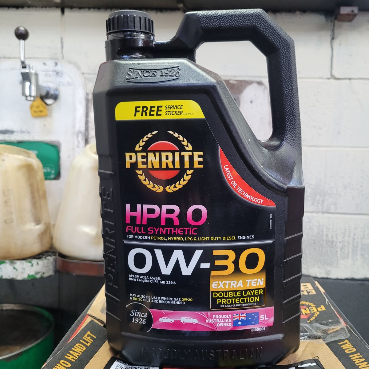 Penrite HPR 0 Full Synthetic 0W-30 Engine Oil Penrite HPR 0 full synthetic 0W-30 engine oil bottle on workshop bench