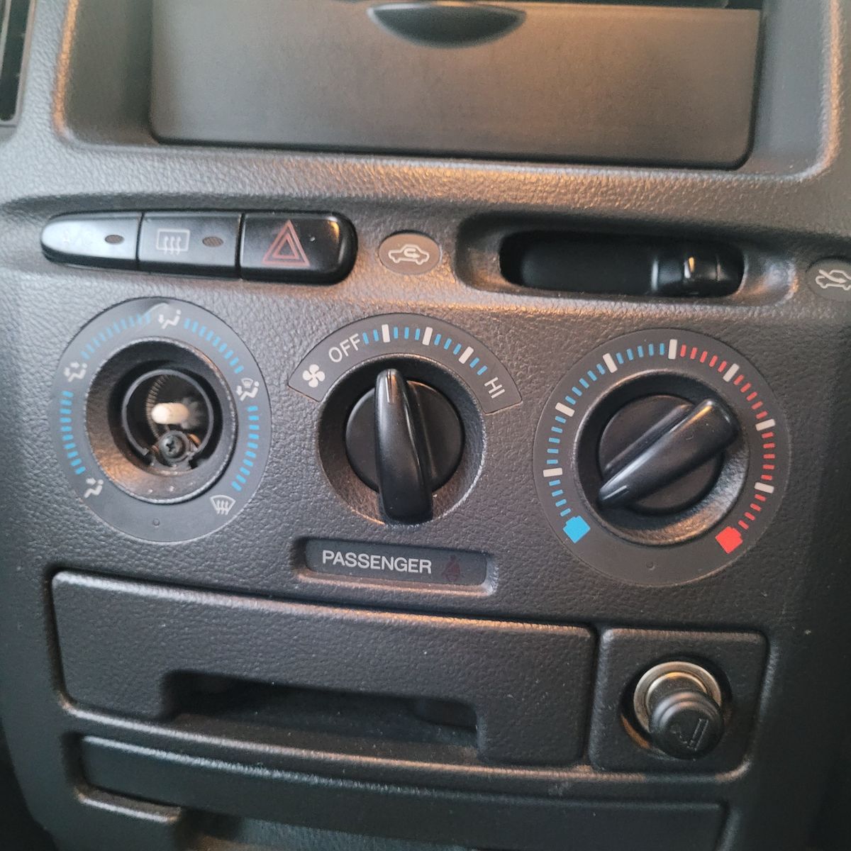 Car Air Conditioning Control Panel Close-up of a car dashboard air conditioning and ventilation control panel.