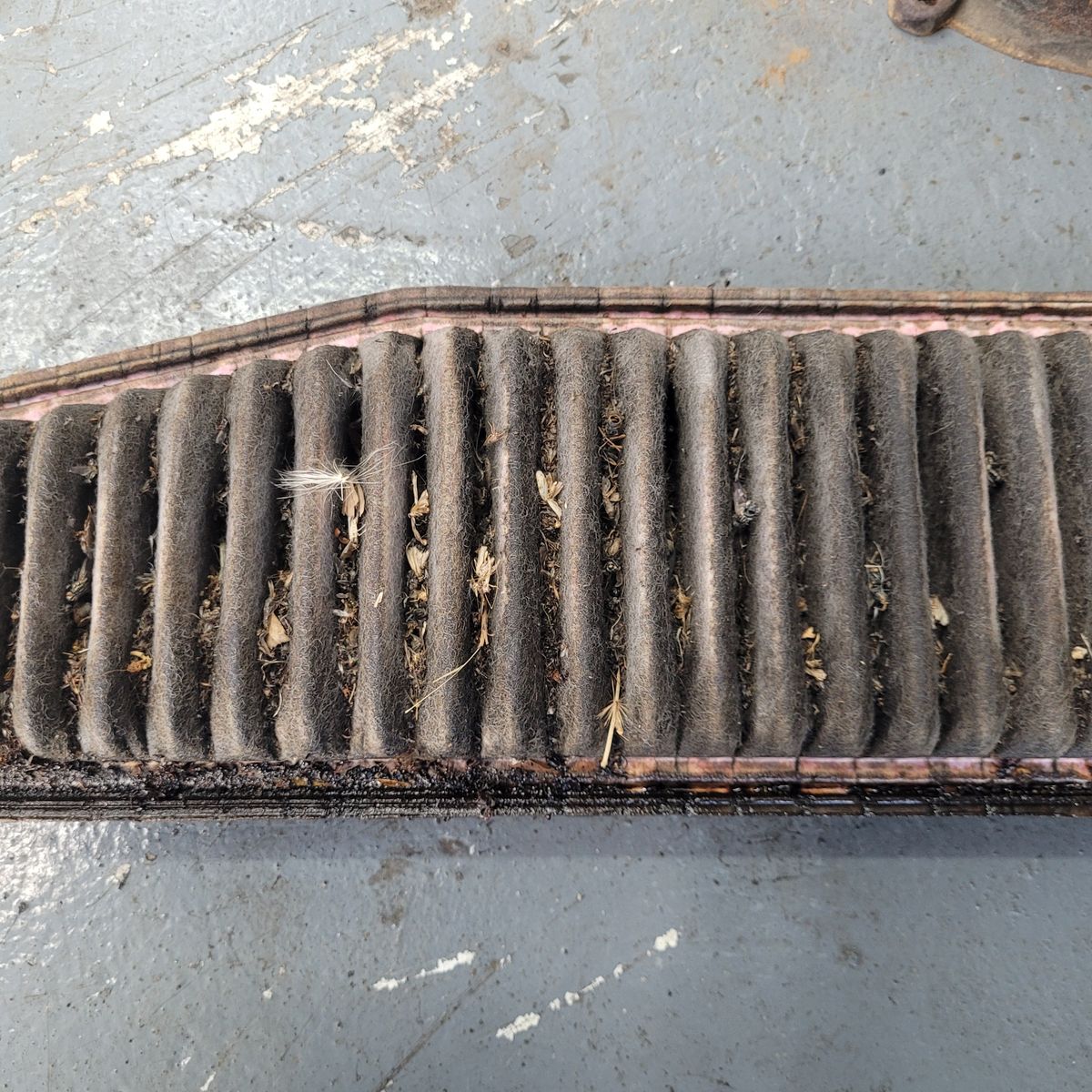 Dirty and Clogged Air Filter Used air filter full of debris, dust, and leaves