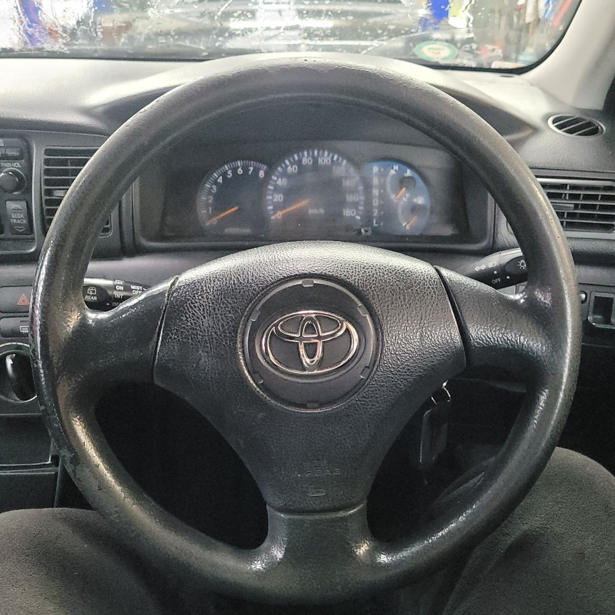 Close-up of Toyota steering wheel with airbag in car interior