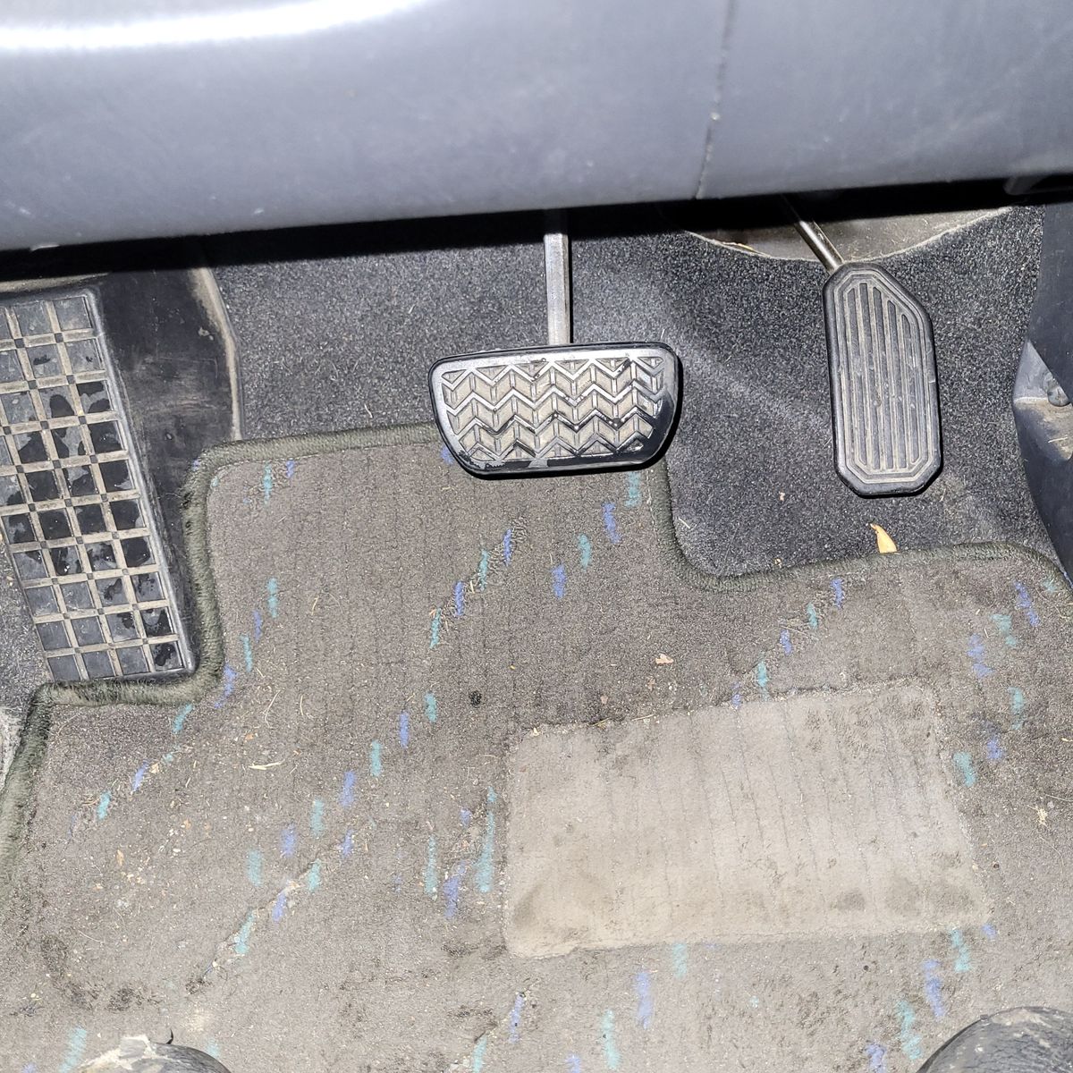 View of brake and accelerator pedals in an automatic car