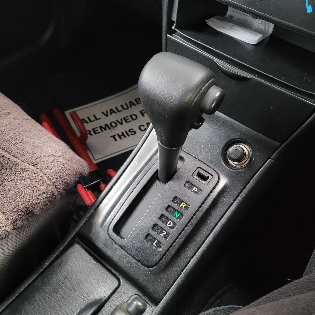 Close-up view of an automatic gear shifter in a car center console