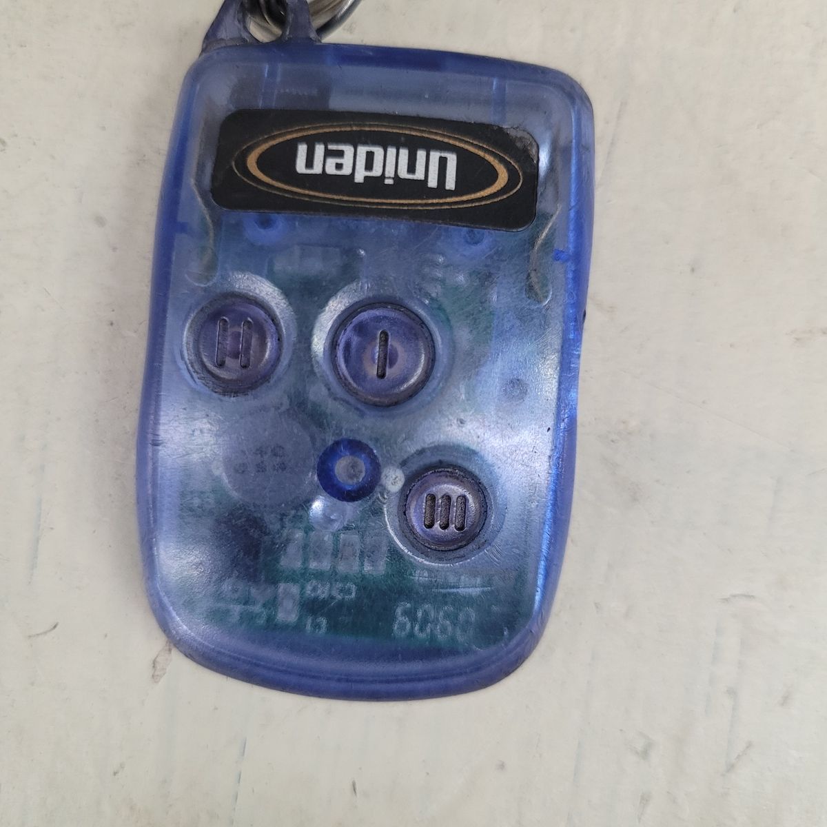 Blue Car Alarm Remote Key Fob Transparent blue car alarm remote with three buttons and a keyring
