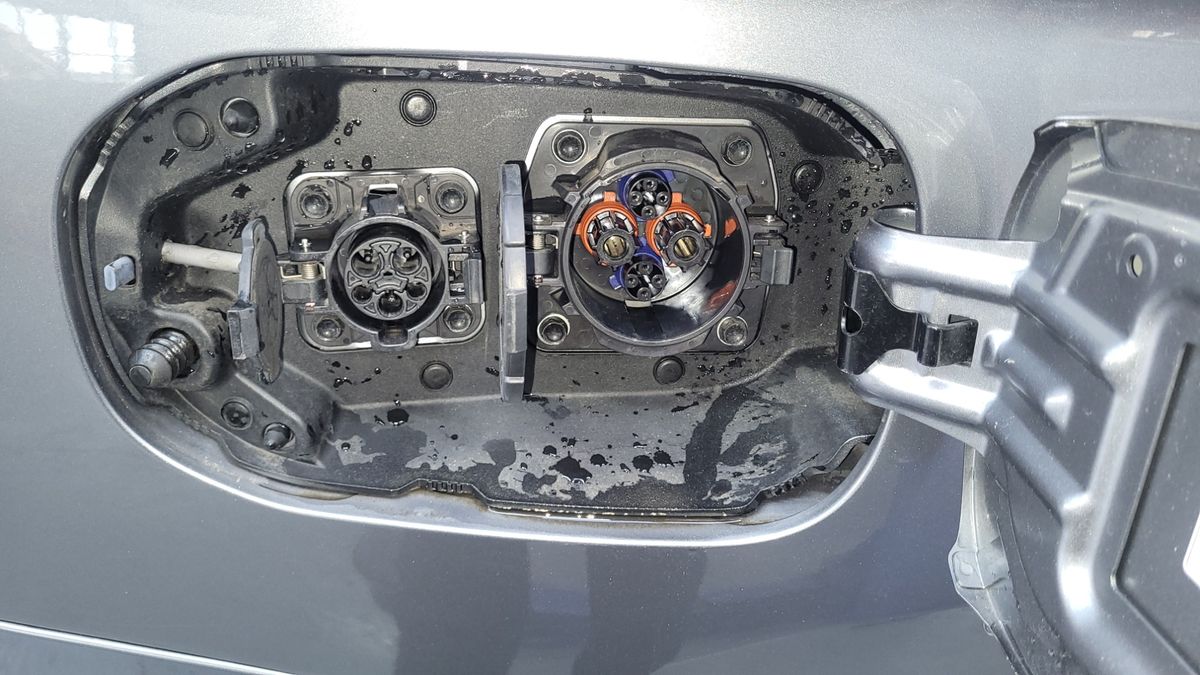 Dual Electric Vehicle Charging Ports on Car Close-up of electric vehicle charging ports under car's charge flap