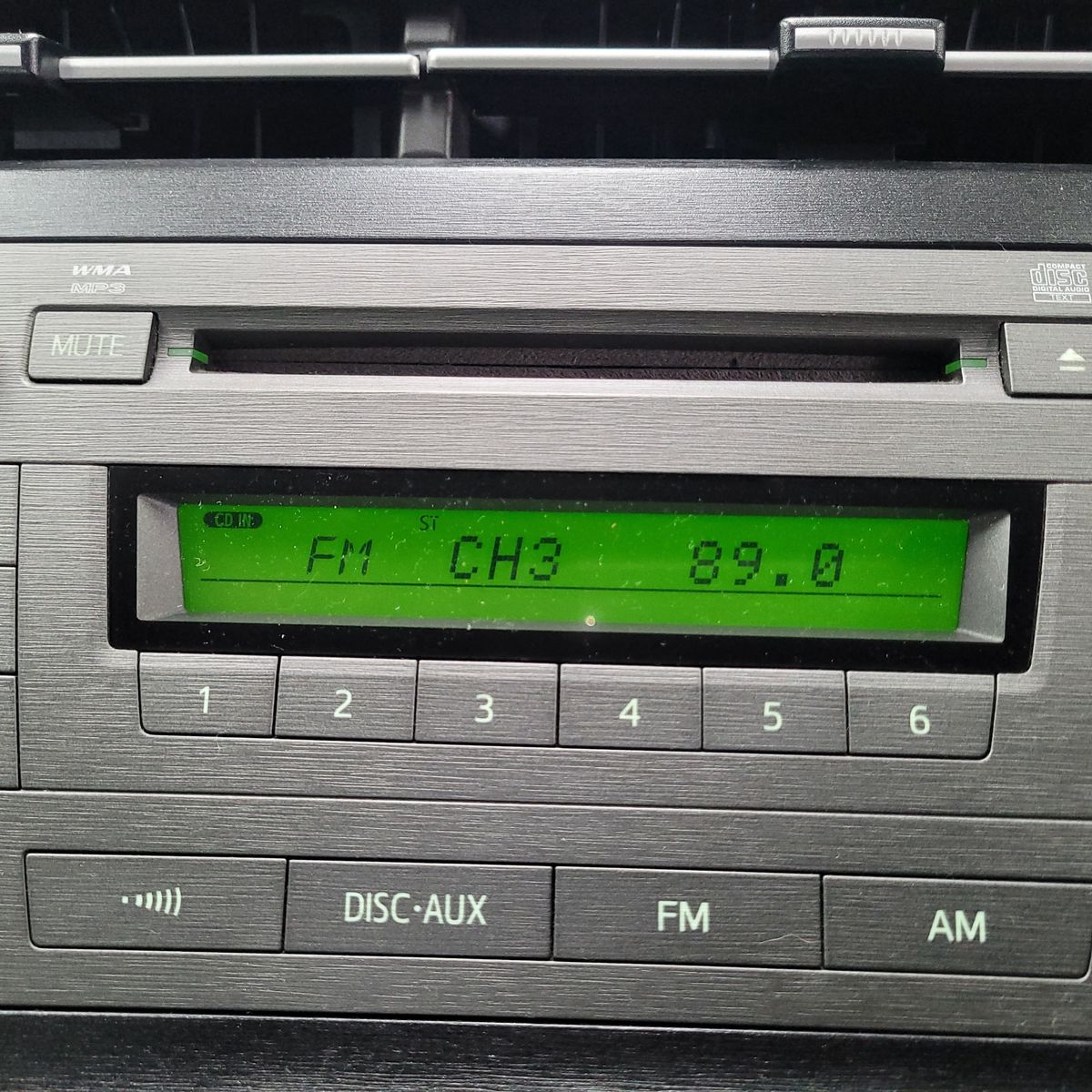 Car Stereo Displaying FM Channel 89.0 Car radio tuned to FM channel 89.0 on a green digital display