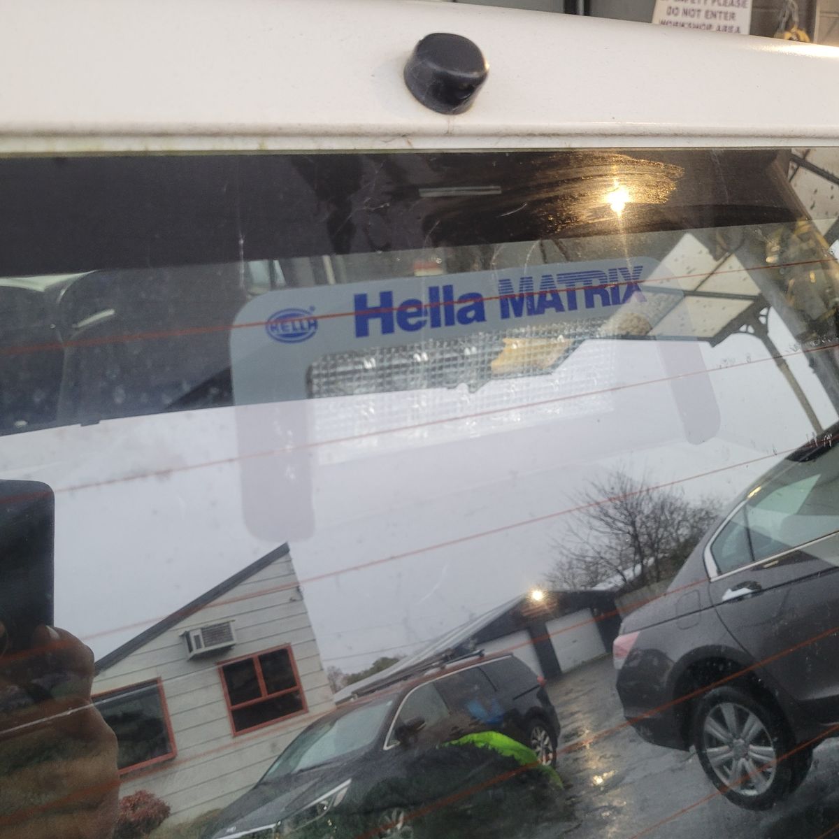 Close-up of a Hella Matrix high-mount stop light through a car's rear window