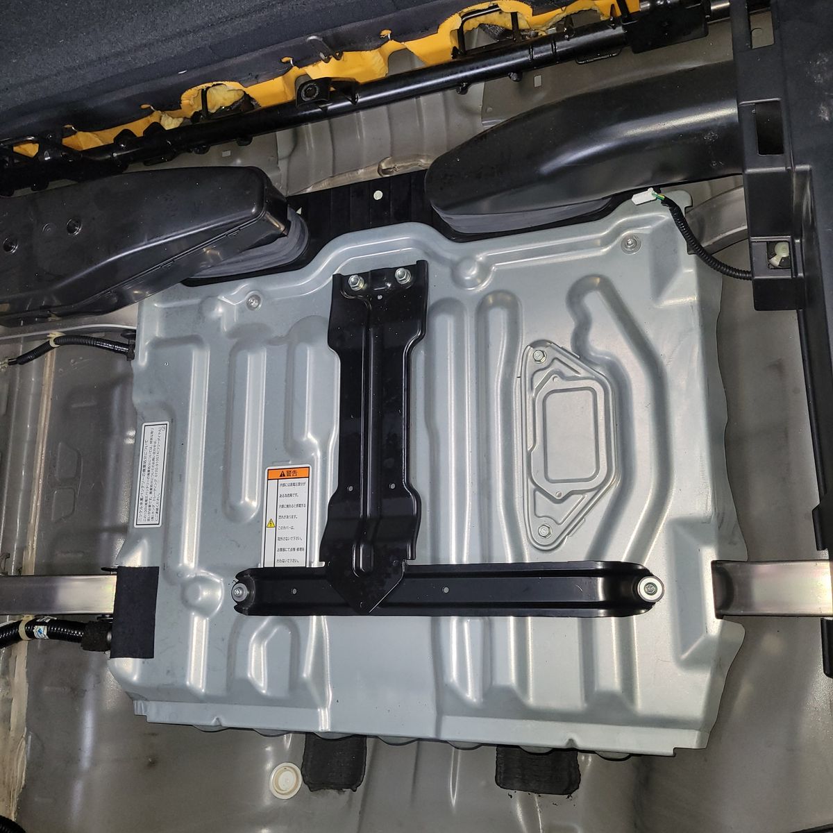 Rectangular metal hybrid battery pack mounted inside vehicle frame