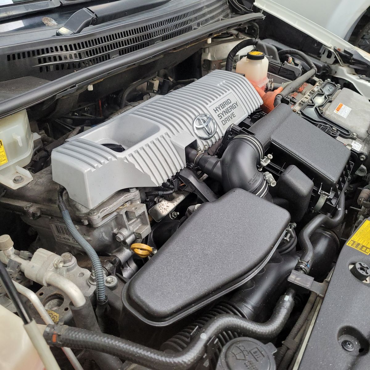 Hybrid Car Engine Bay with Toyota Hybrid Synergy Drive Toyota Hybrid Synergy Drive engine in a hybrid car