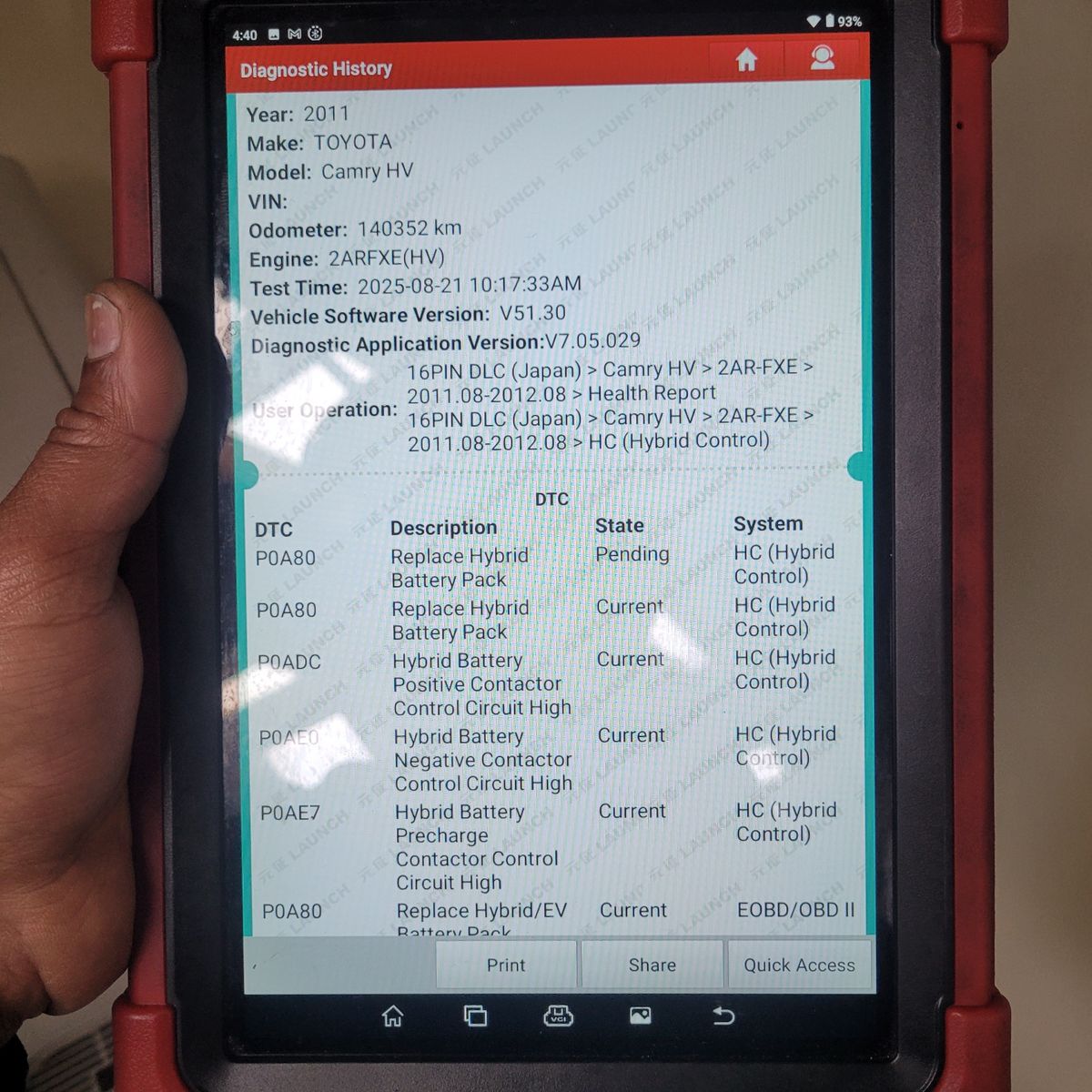 Toyota Camry Hybrid Fault Diagnostic Report on Scanner Close-up of a handheld diagnostic scanner showing hybrid battery faults for a Toyota Camry HV.