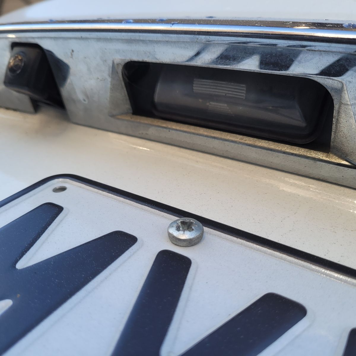 Number plate bulb above car license plate and screw