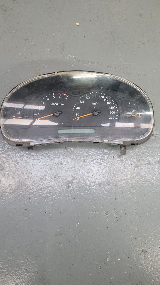 Disassembled car speedometer cluster with tachometer and fuel gauge