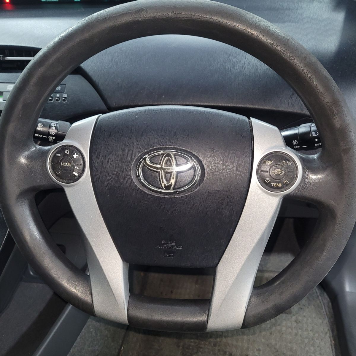 Toyota Steering Wheel with Controls Toyota car steering wheel featuring audio and trip controls