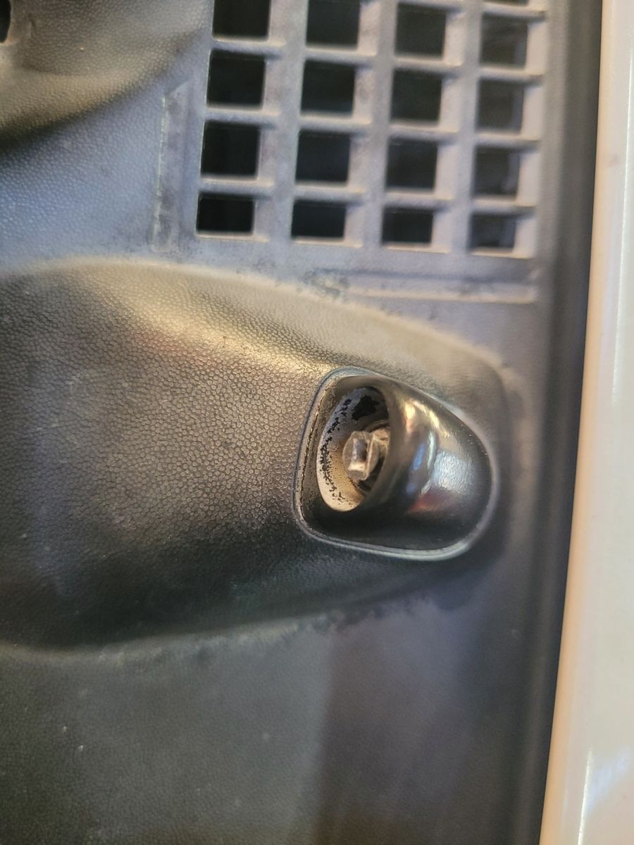 Close-up of Car Windshield Washer Jet Nozzle Detailed view of a car windshield washer jet on a vehicle hood