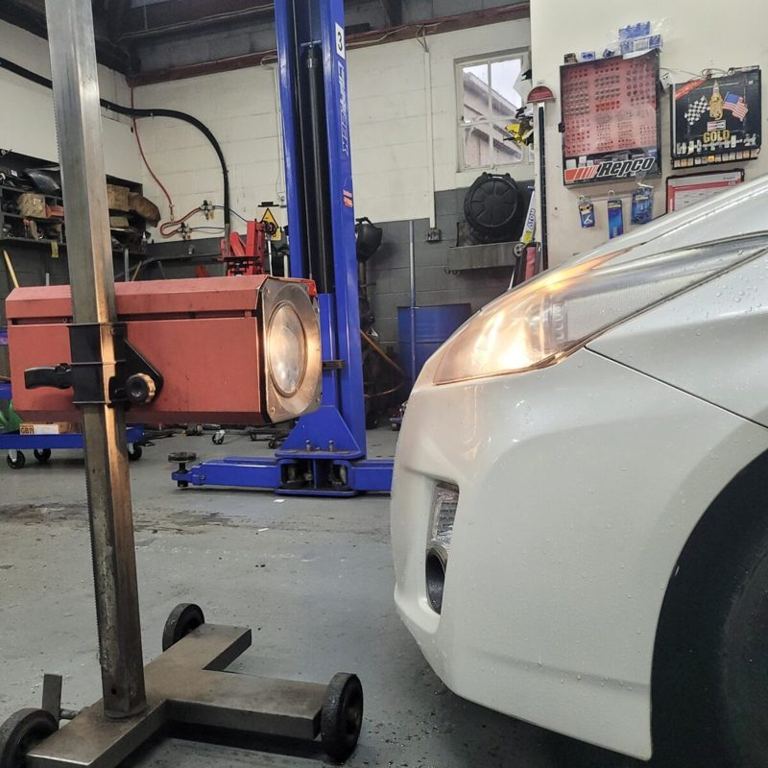 Headlight aim check during a WOF at Grimmer Motors in Hamilton